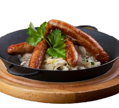 Fried smoked farm sausage served with white sauerkraut and Tyrolean bacon200 g smoked sausages, sauerkraut, cabbage, mushrooms, Tyrolean bacon